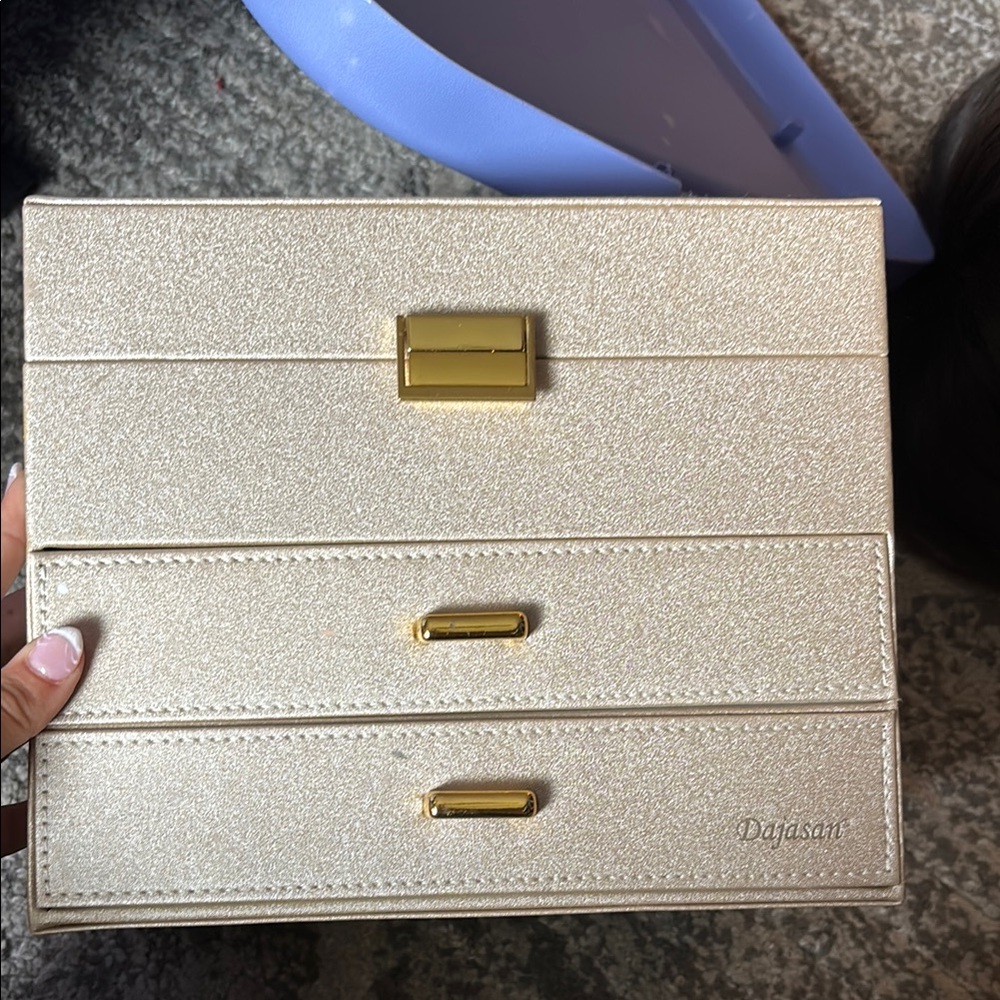 Gold/cream/glittery Jewelry Box holds a lot and has many compartments to store